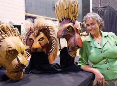 Sue McLaughlin, with three of the many puppets and masks she tends to backstage at Disney’s “The Lion King,” playing the Boston Opera House September 9 - October 12. 	Photo by Selena Moshell